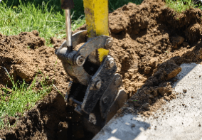 Machine digging hole